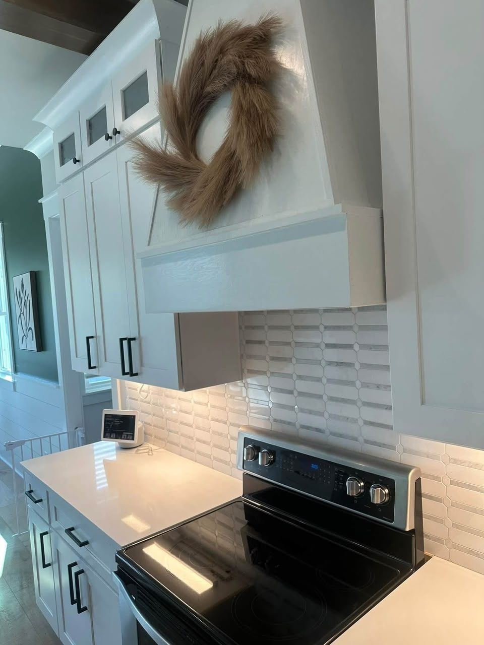 Clean kitchen range and white cabinets